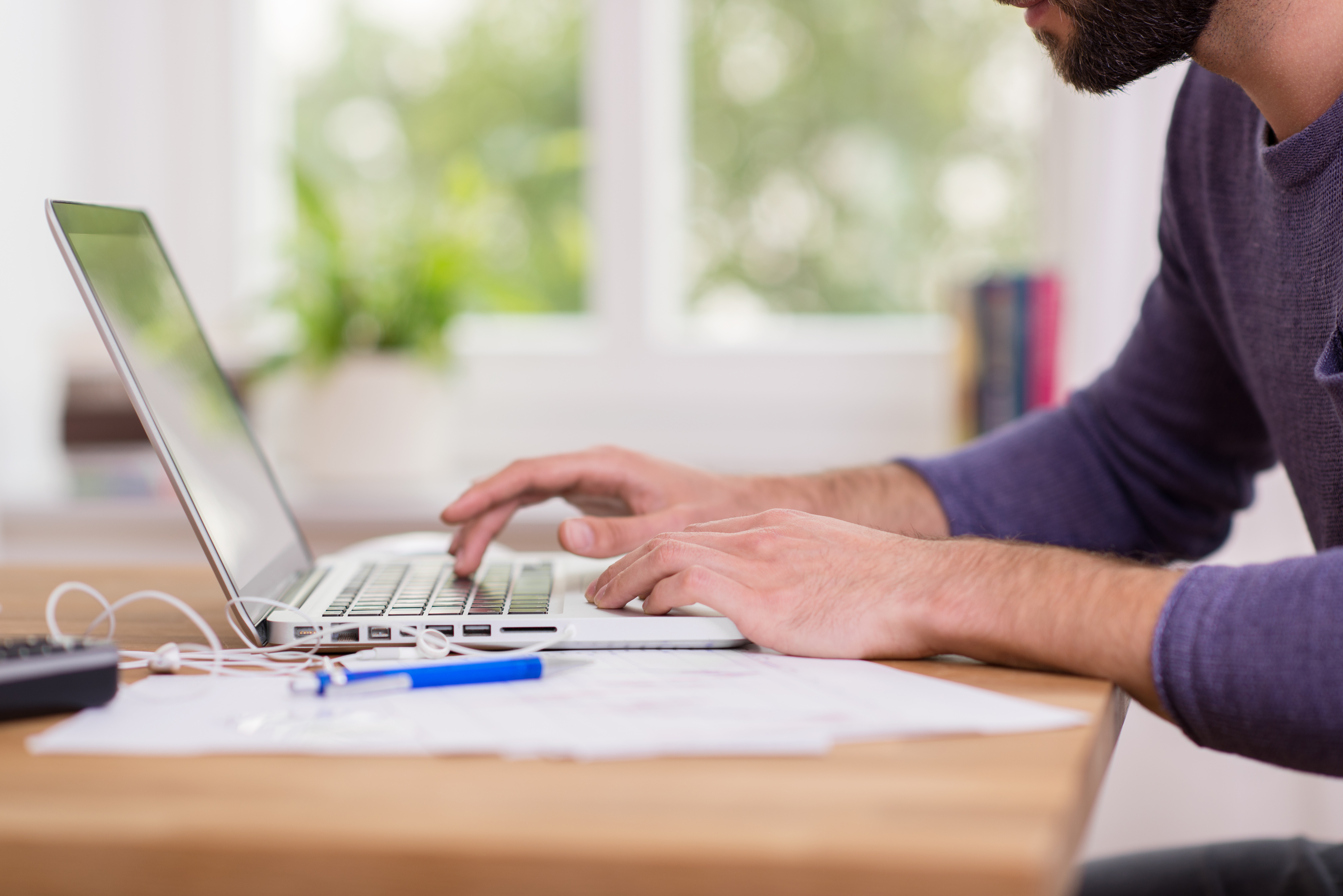 Man working from home on a laptop computer